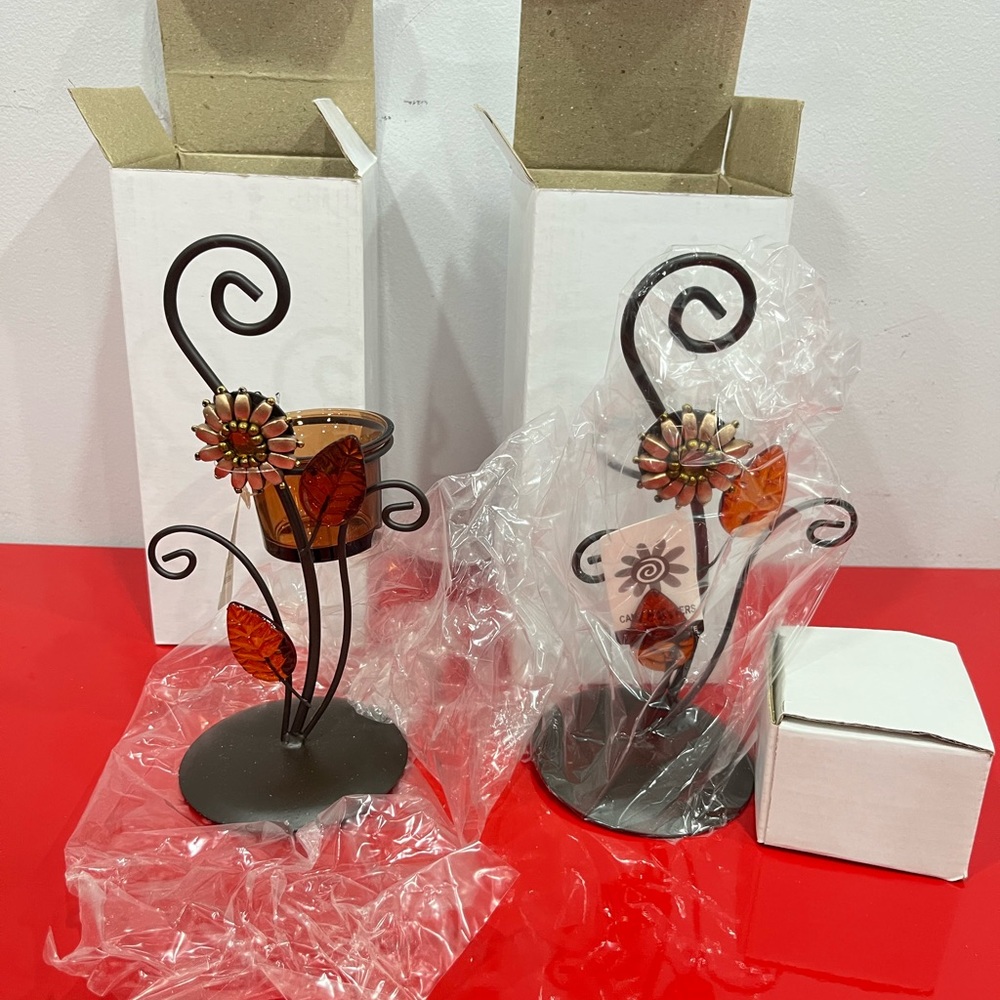 Brown candle holder , flower and leaf design . $9 for 2 a set . Brand new in box